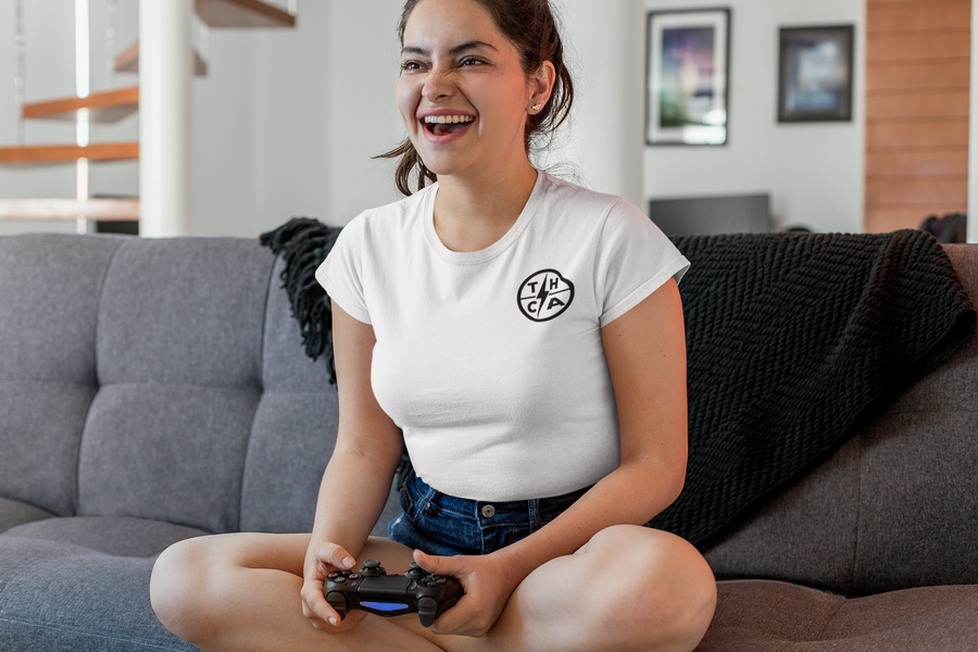 Woman in Official Try Hard Gear holding a controller